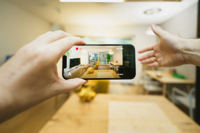 A person taking a picture of a kitchen